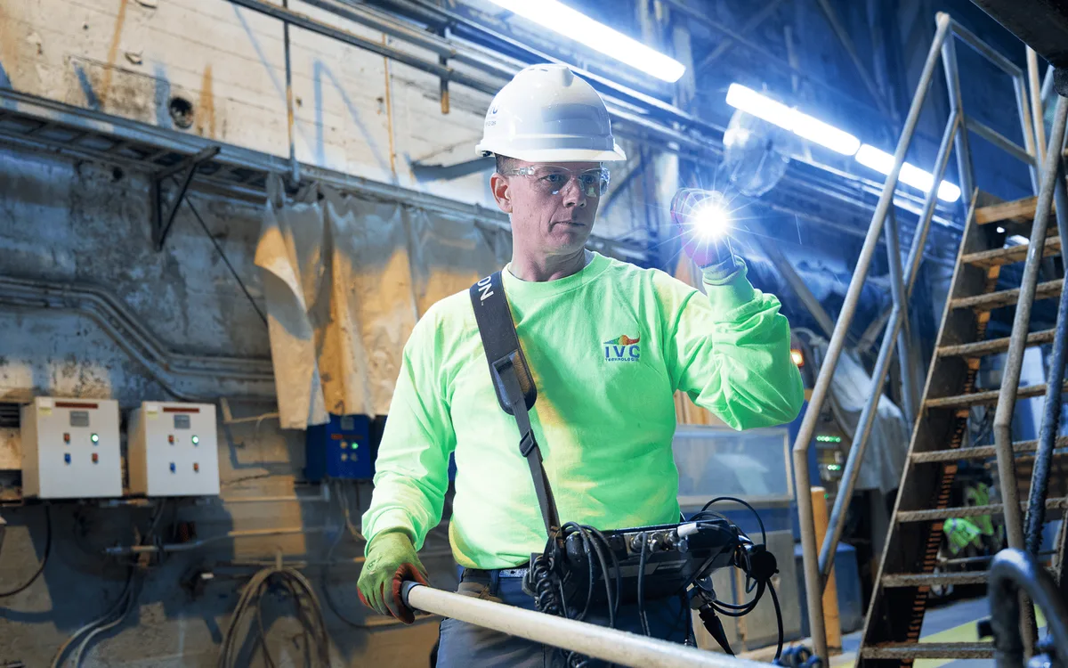 An IVC specialist testing industrial equipment