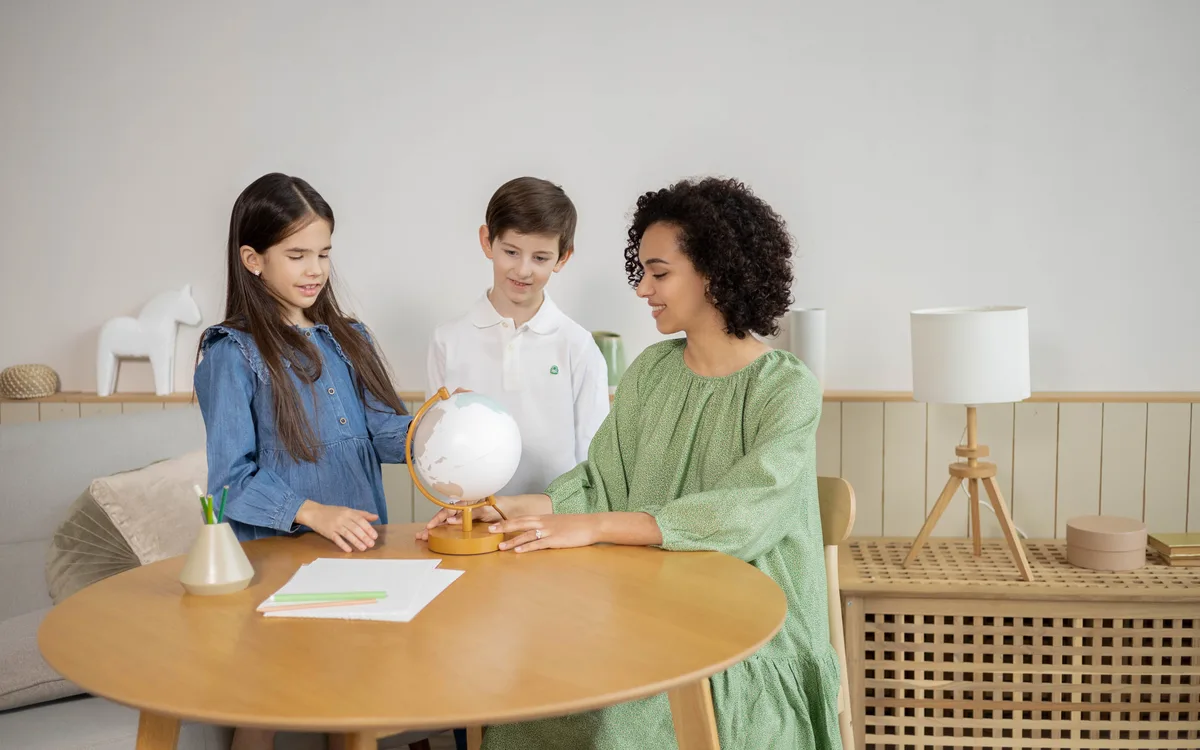 Illustrative stock: A teacher and students learning together in a classroom