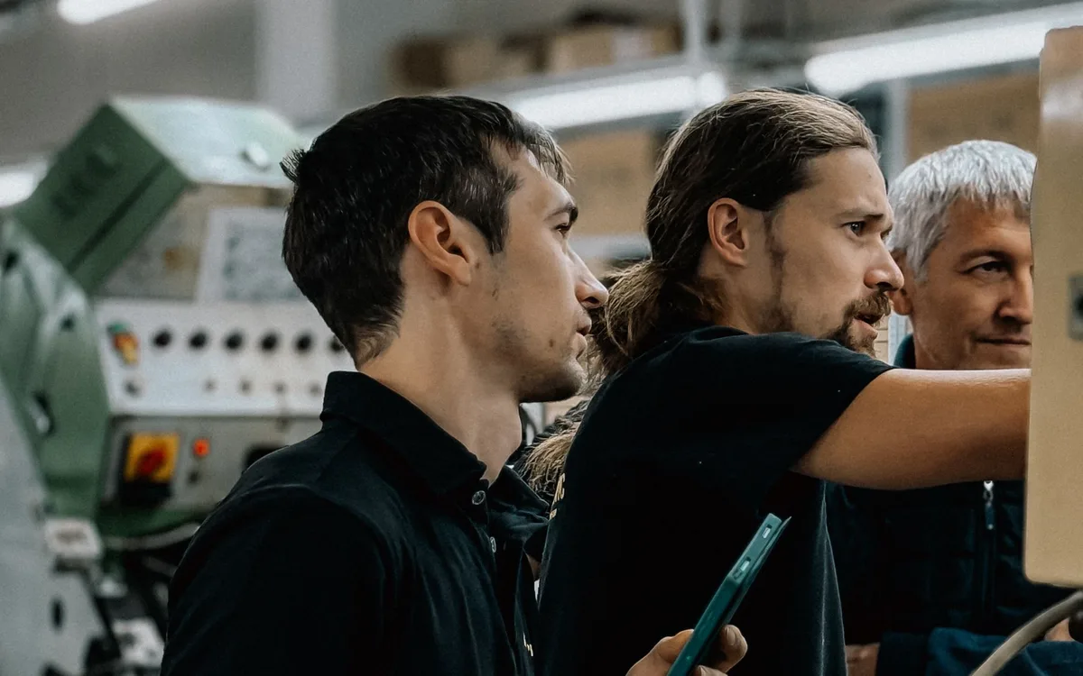 Illustrative stock: A manufacturing team working together on the factory floor