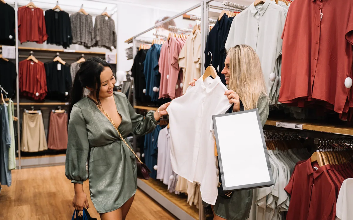 Illustrative stock: Customers choosing clothes in a boutique