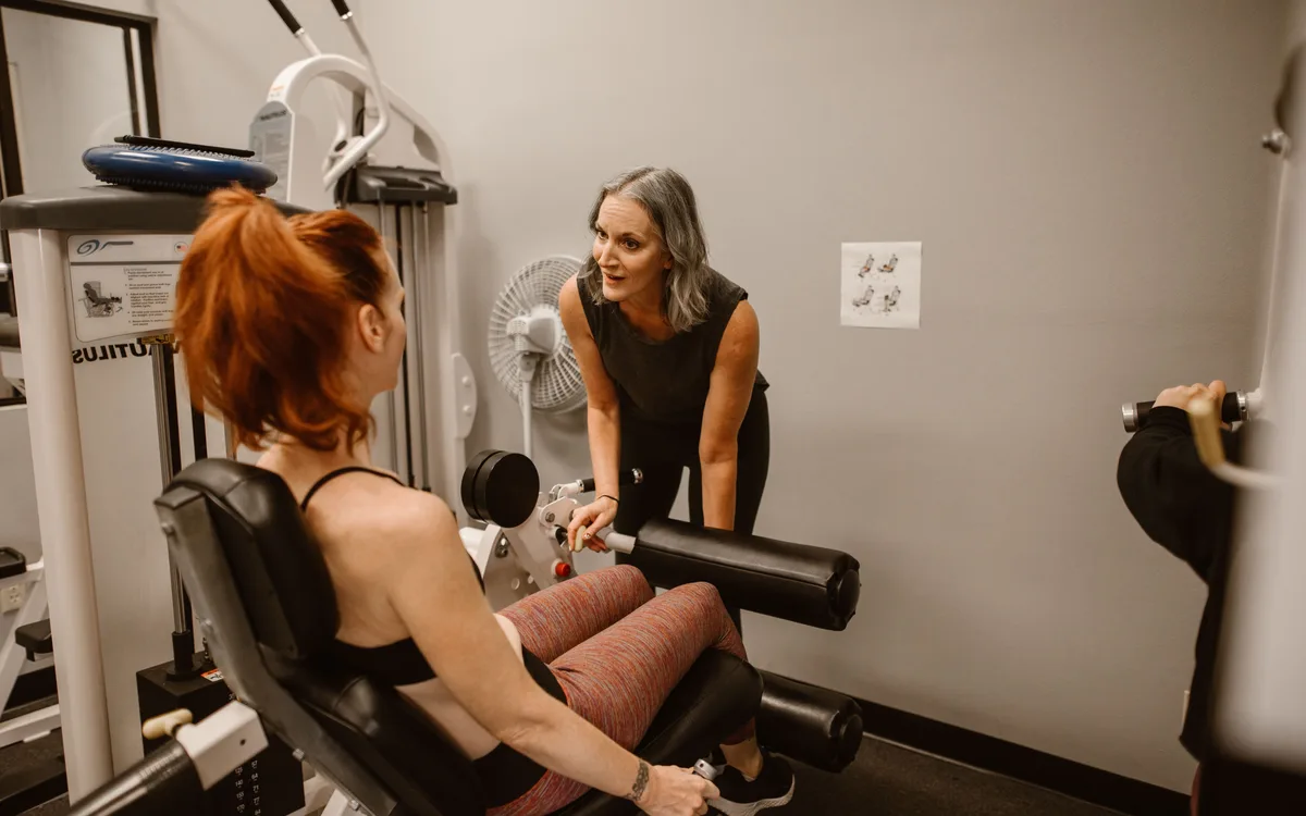 Illustrative stock: A trainer coaching members in a health club