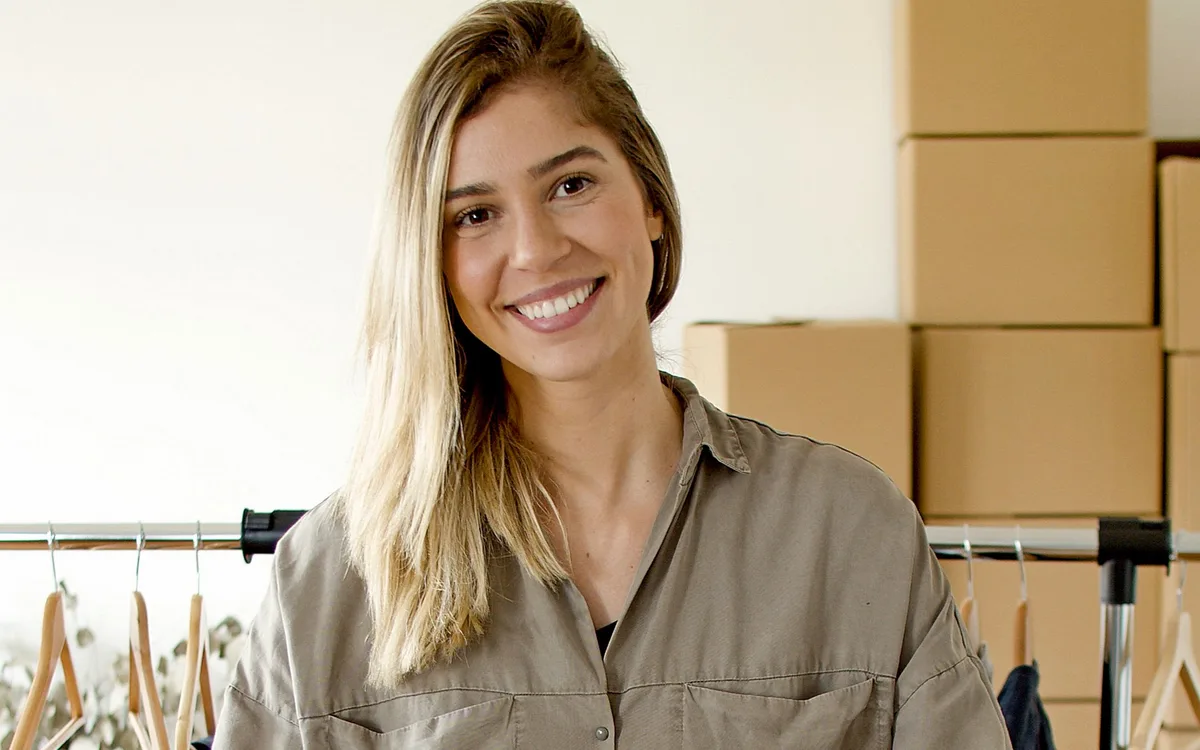 Illustrative stock: An online store owner preparing a customer package