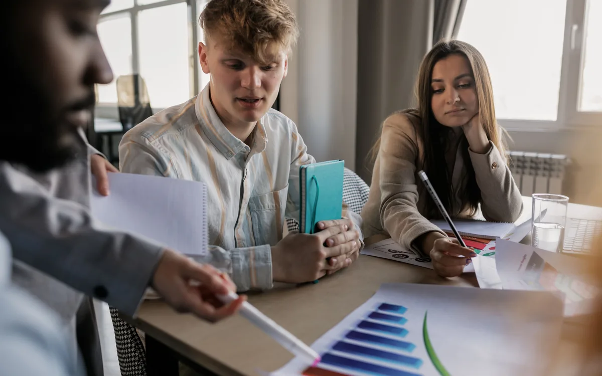 Illustrative stock: A team reviewing reporting and business results