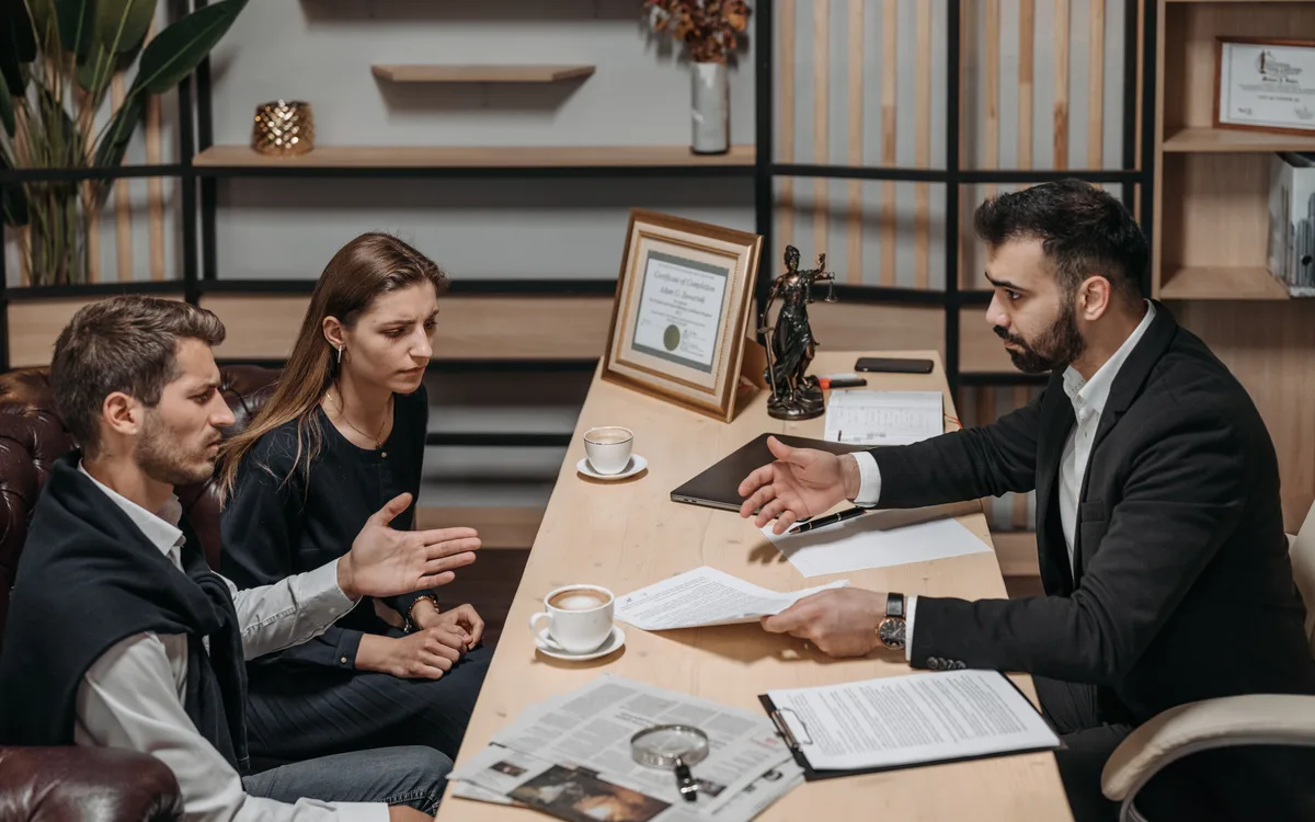Illustrative stock: A legal professional consulting with clients