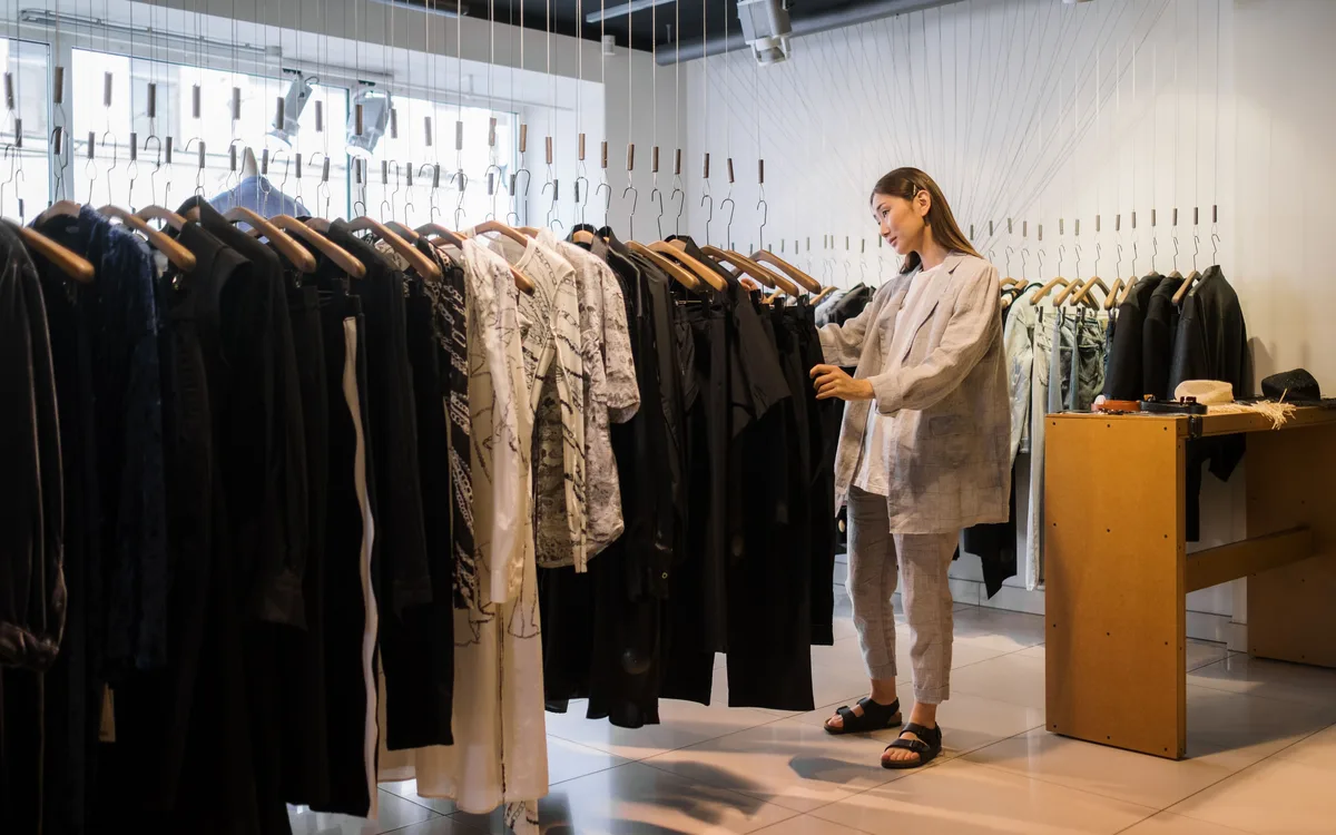 Illustrative stock: A customer browsing clothing in a store